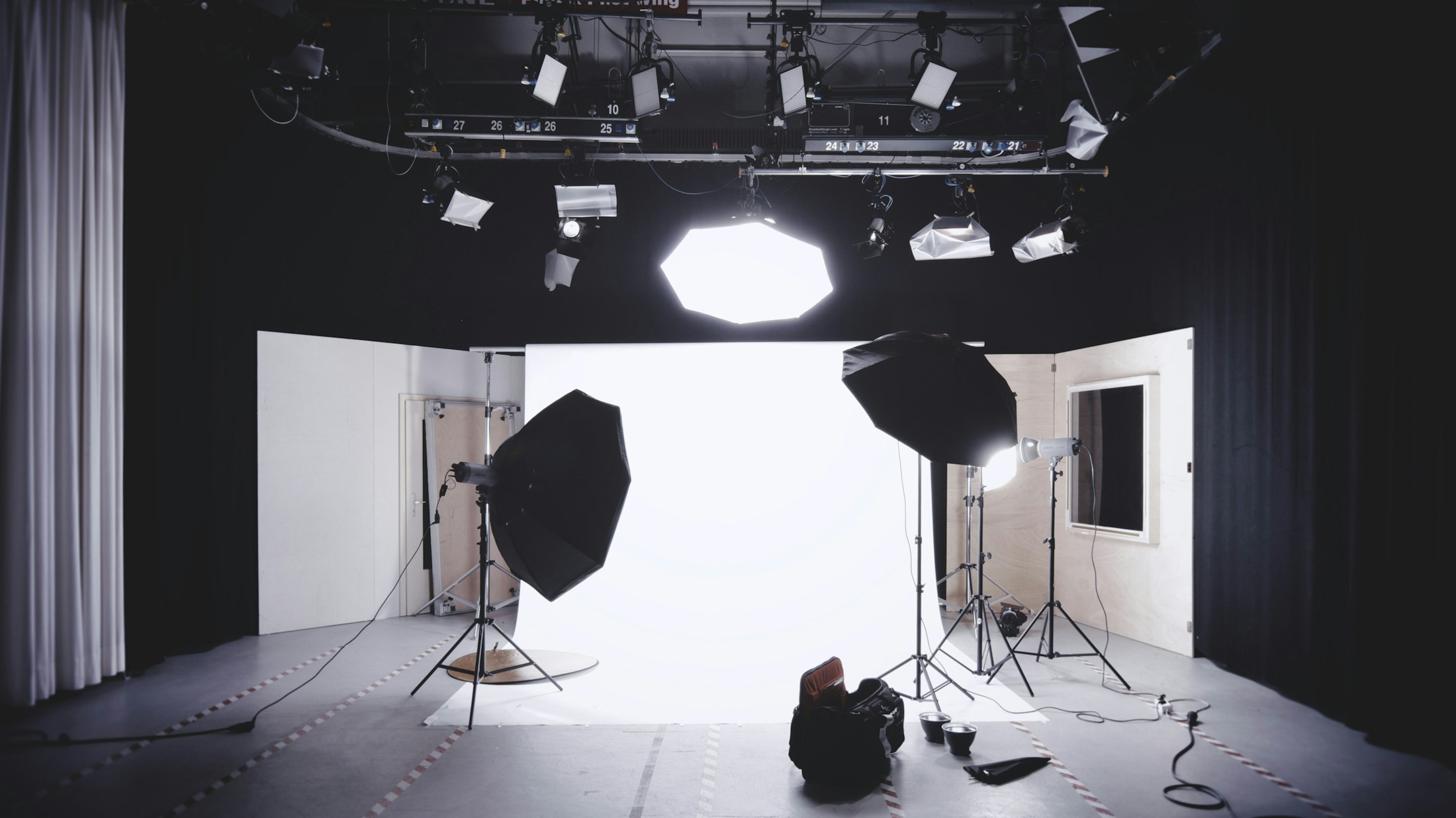Professional photography studio with multiple lighting setups